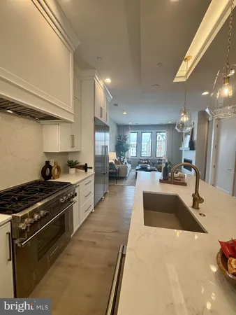 a large kitchen with stainless steel appliances