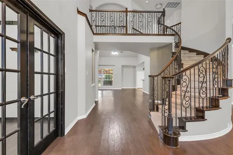 a view of entryway with wooden floor