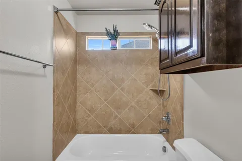 a bathroom with a sink and a shower