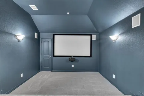 a bedroom with a bed and a ceiling fan