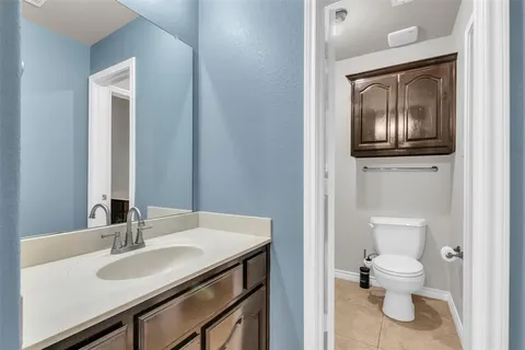 a bathroom with a shower sink vanity and mirror