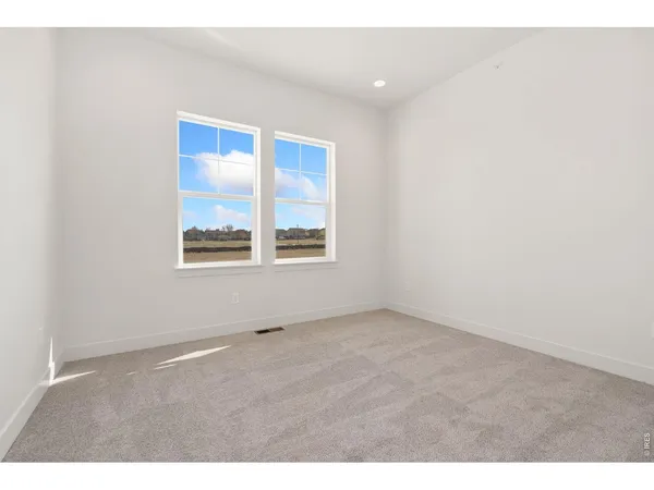 an empty room with windows