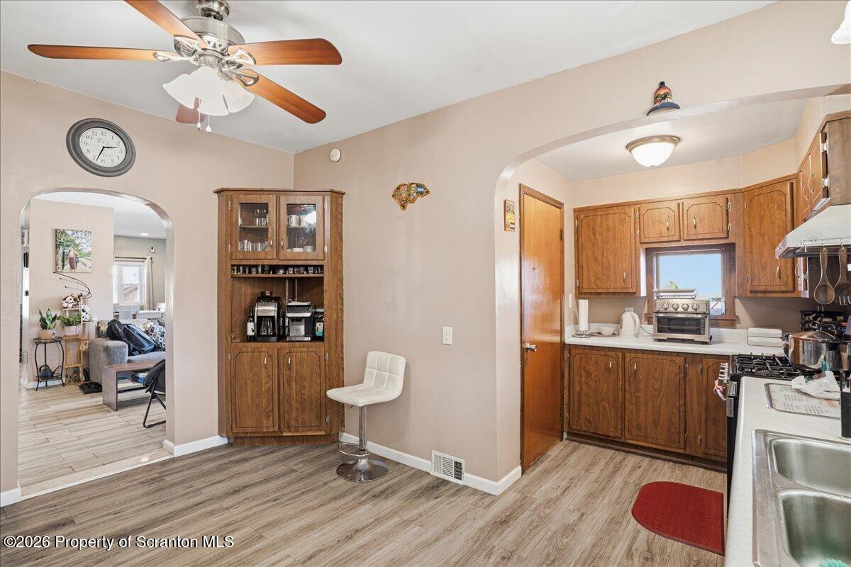 227 Reese Street Scranton, PA 18508 - Photo 17 of 56 a view of kitchen with sink microwave refrigerator and cabinets