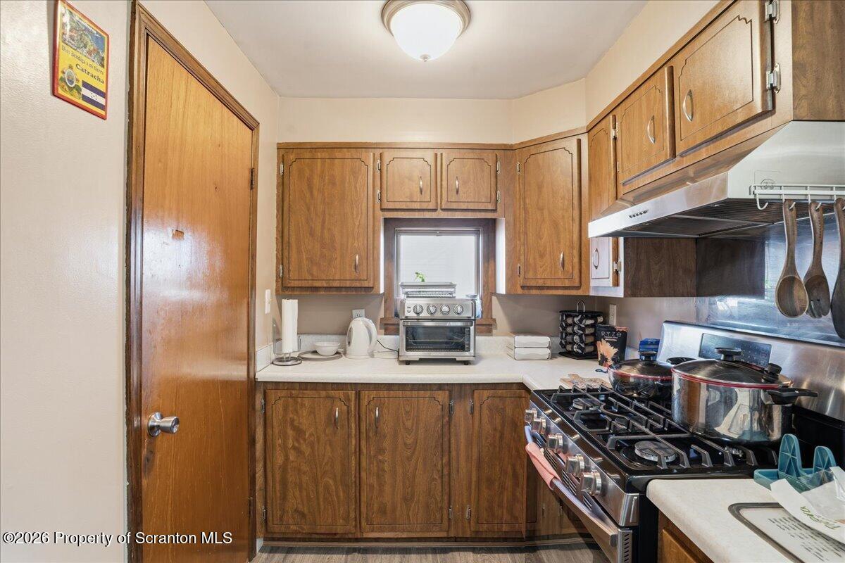 227 Reese Street Scranton, PA 18508 - Photo 19 of 56 a kitchen with sink a stove and cabinets