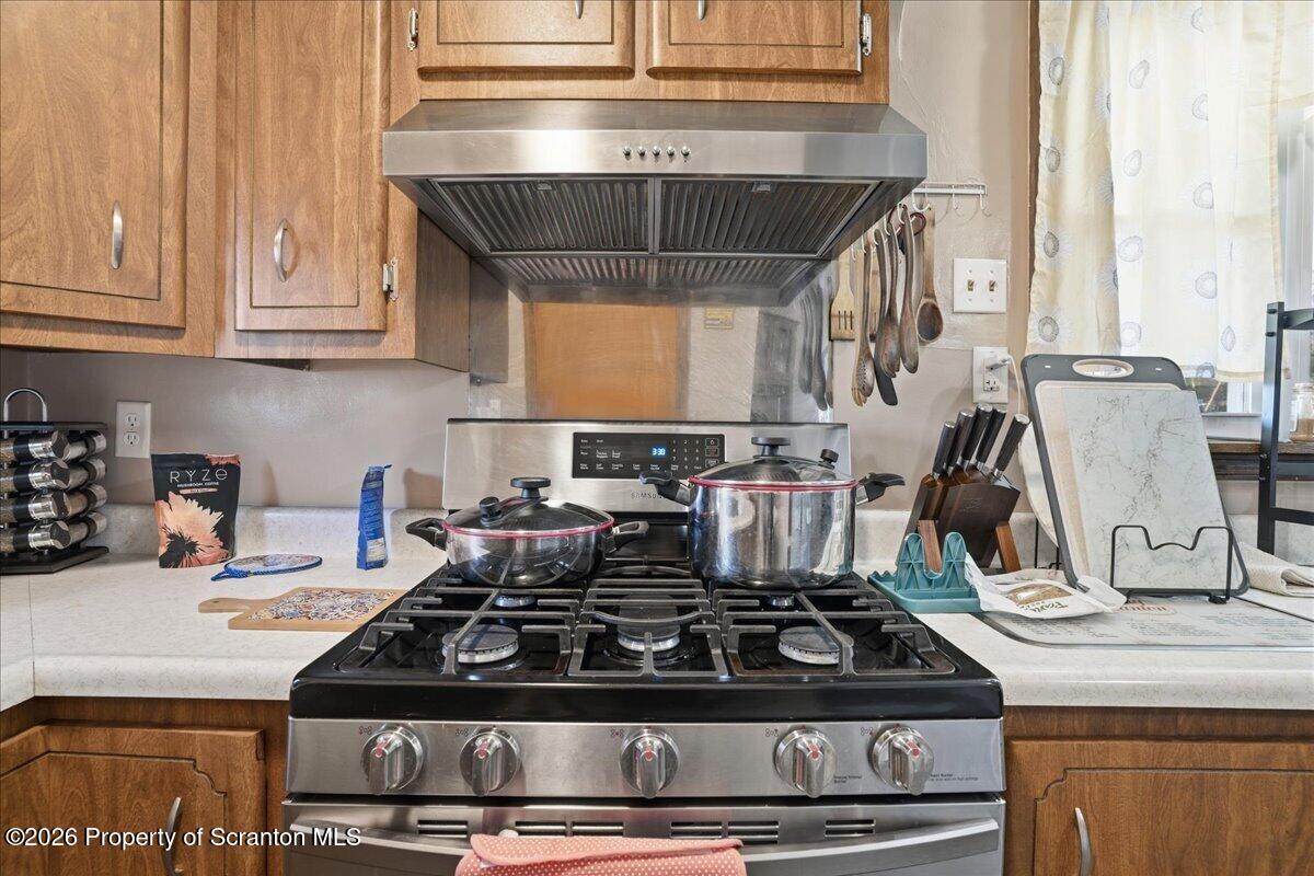 227 Reese Street Scranton, PA 18508 - Photo 22 of 56 a stove top oven sitting inside of a kitchen