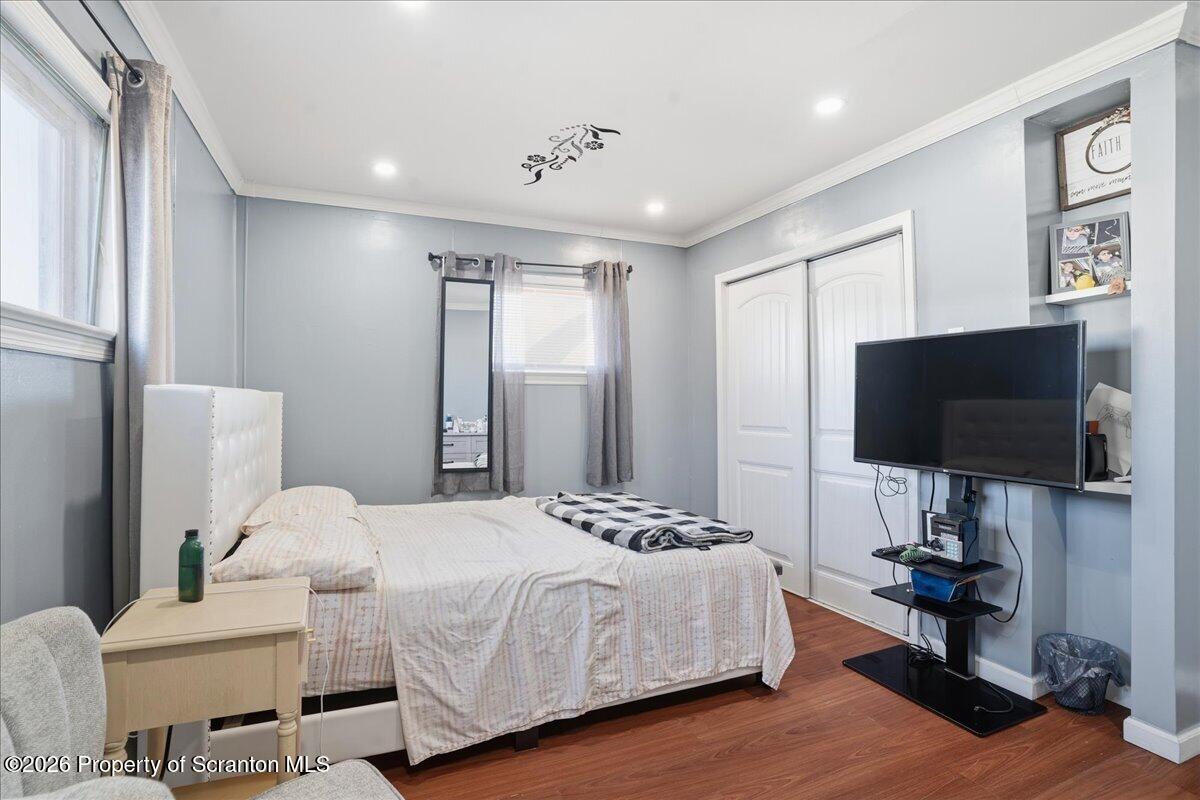 227 Reese Street Scranton, PA 18508 - Photo 24 of 56 a bedroom with a bed tv and a window