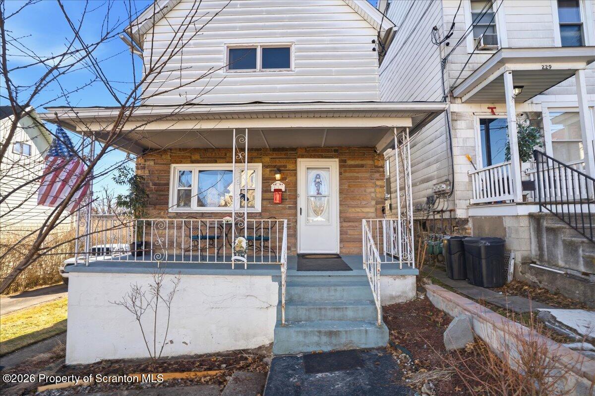 227 Reese Street Scranton, PA 18508 - Photo 4 of 56 a view of a brick house with many windows