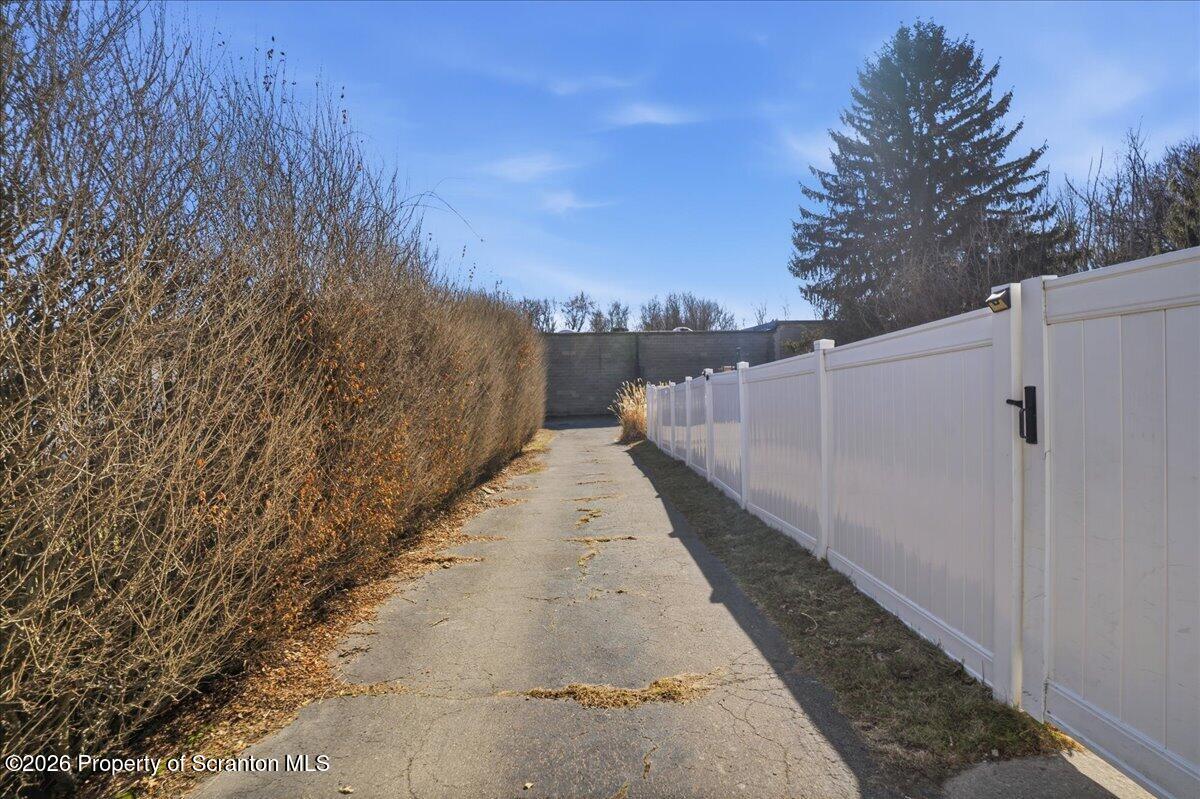 227 Reese Street Scranton, PA 18508 - Photo 41 of 56 a view of a pathway with a wrought fence
