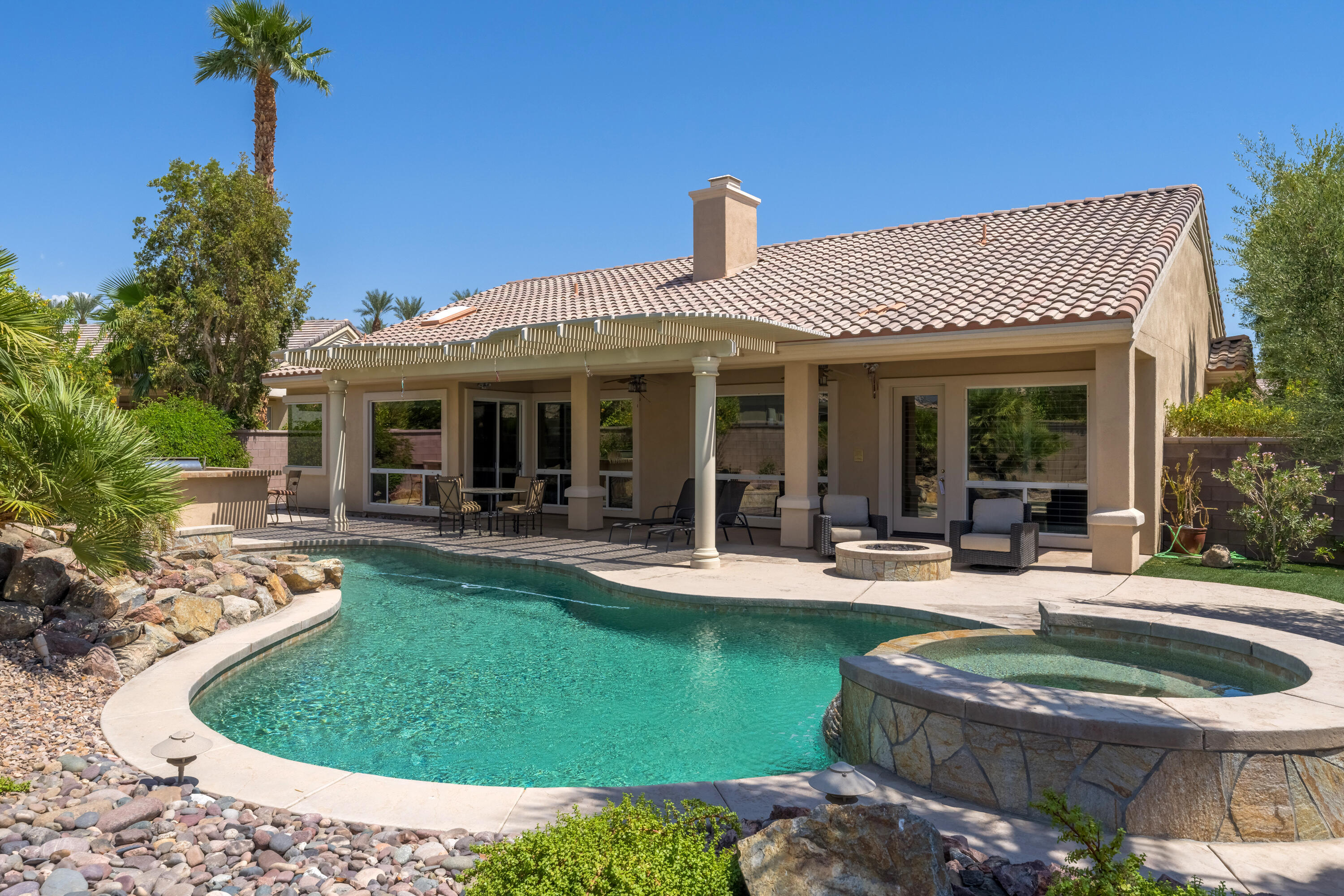 a view of a house with backyard porch and patio