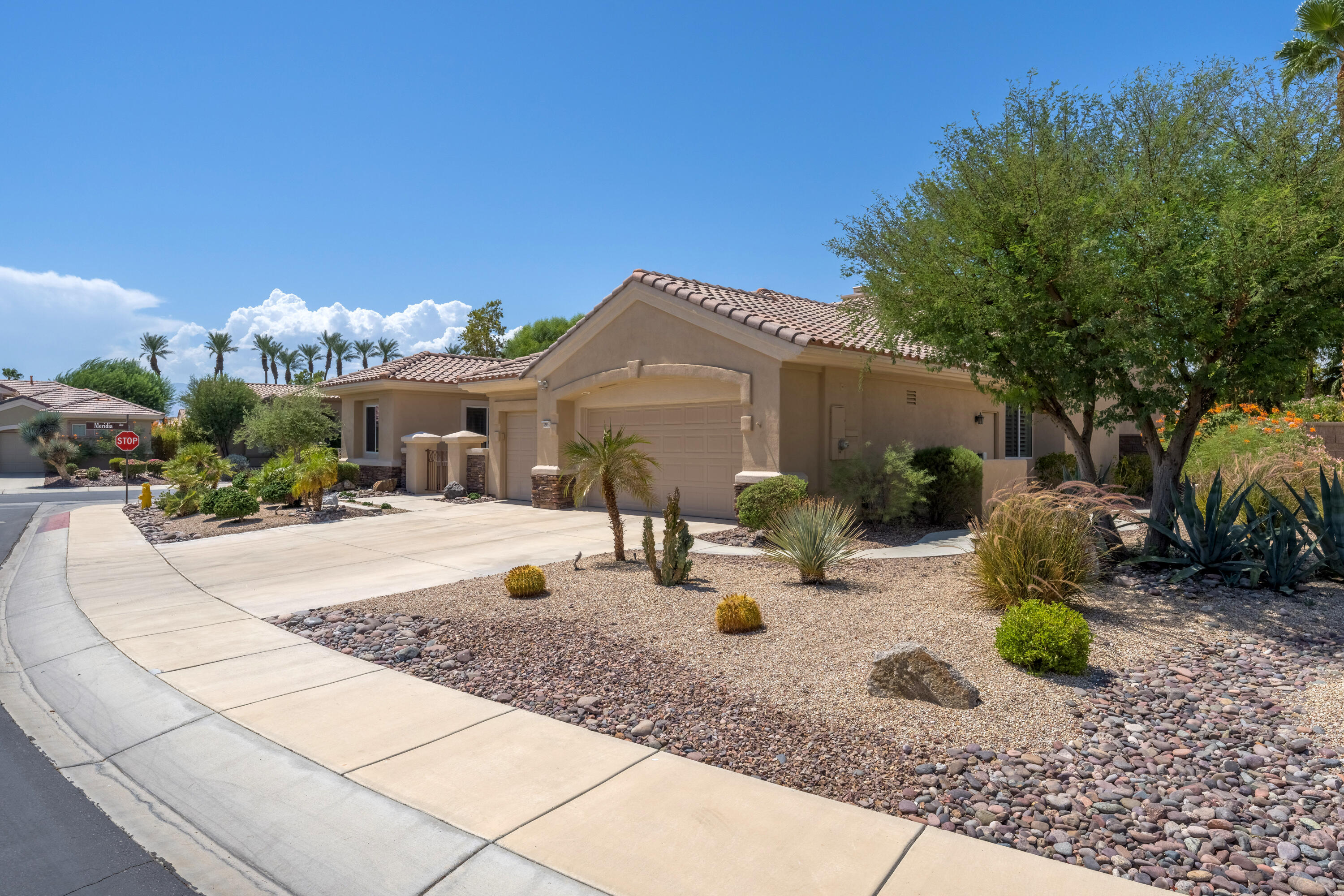 35691 Talus Lane Palm Desert, CA 92211 - Photo 11 of 39 a front view of house with yard outdoor seating and barbeque oven