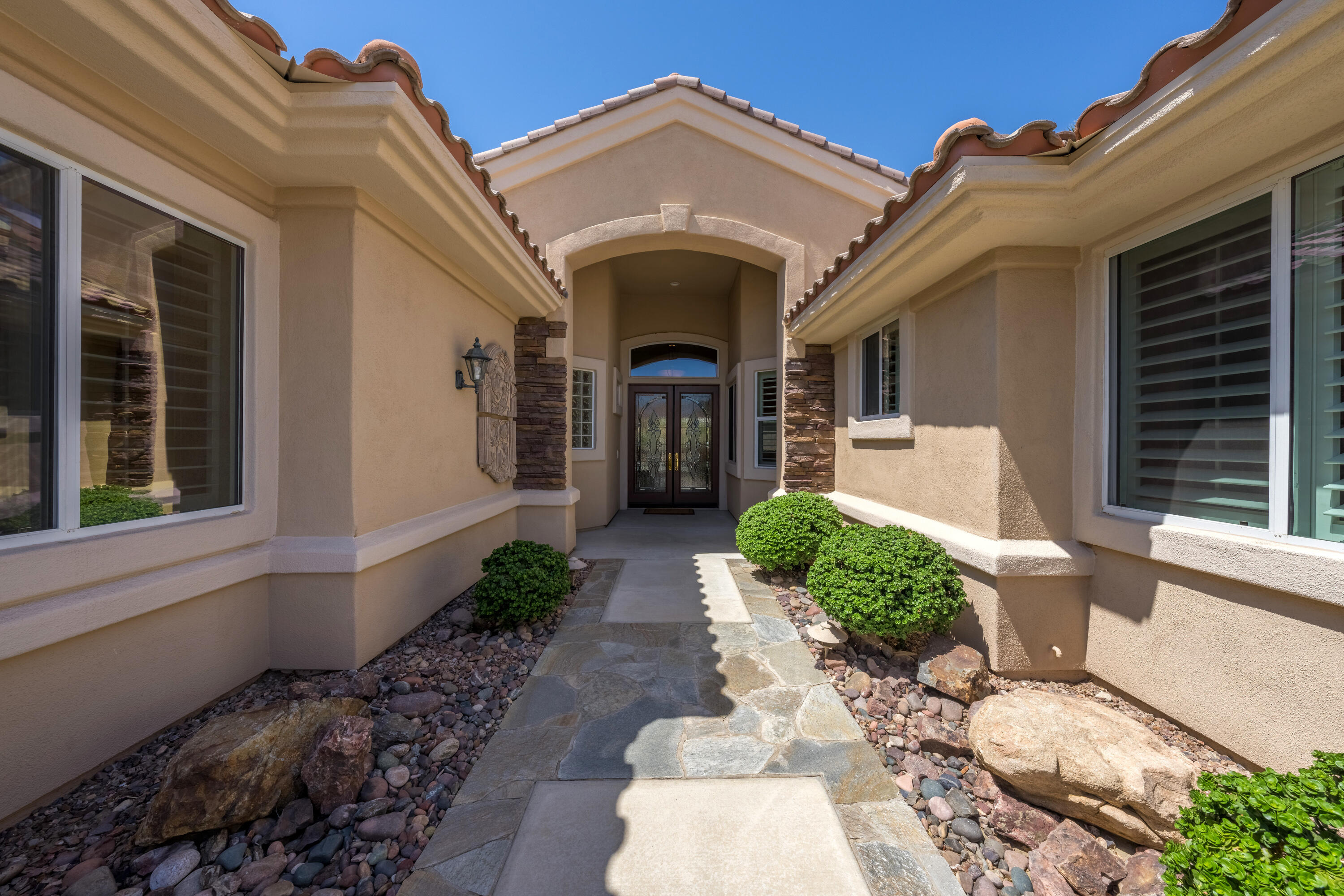 35691 Talus Lane Palm Desert, CA 92211 - Photo 12 of 39 a front view of a house with garden