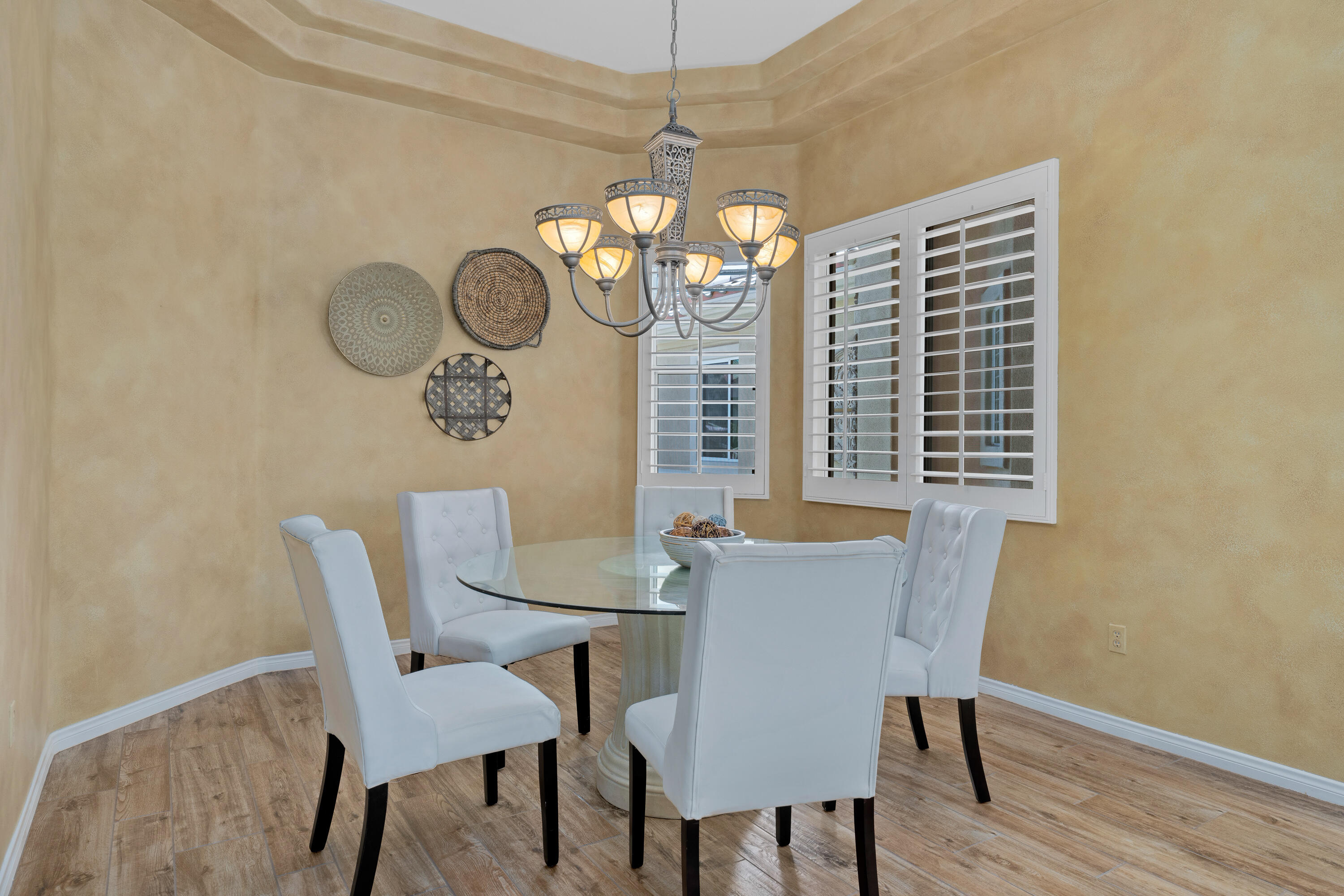35691 Talus Lane Palm Desert, CA 92211 - Photo 19 of 39 a view of a dining room with furniture wooden floor and chandelier