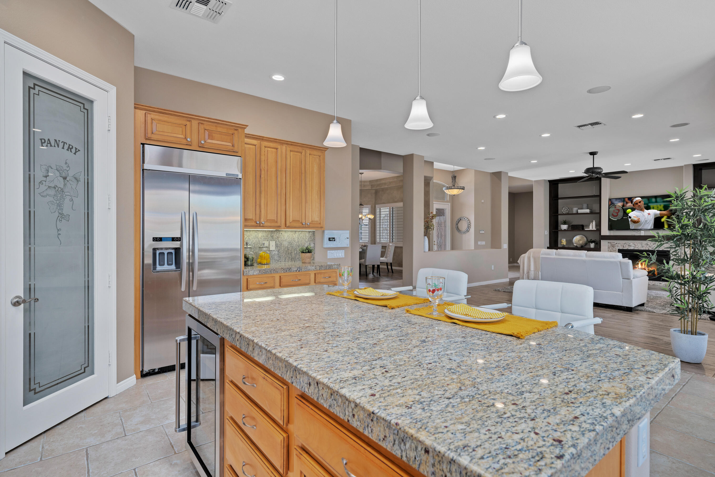 35691 Talus Lane Palm Desert, CA 92211 - Photo 23 of 39 a kitchen with stainless steel appliances granite countertop a sink a stove and a refrigerator