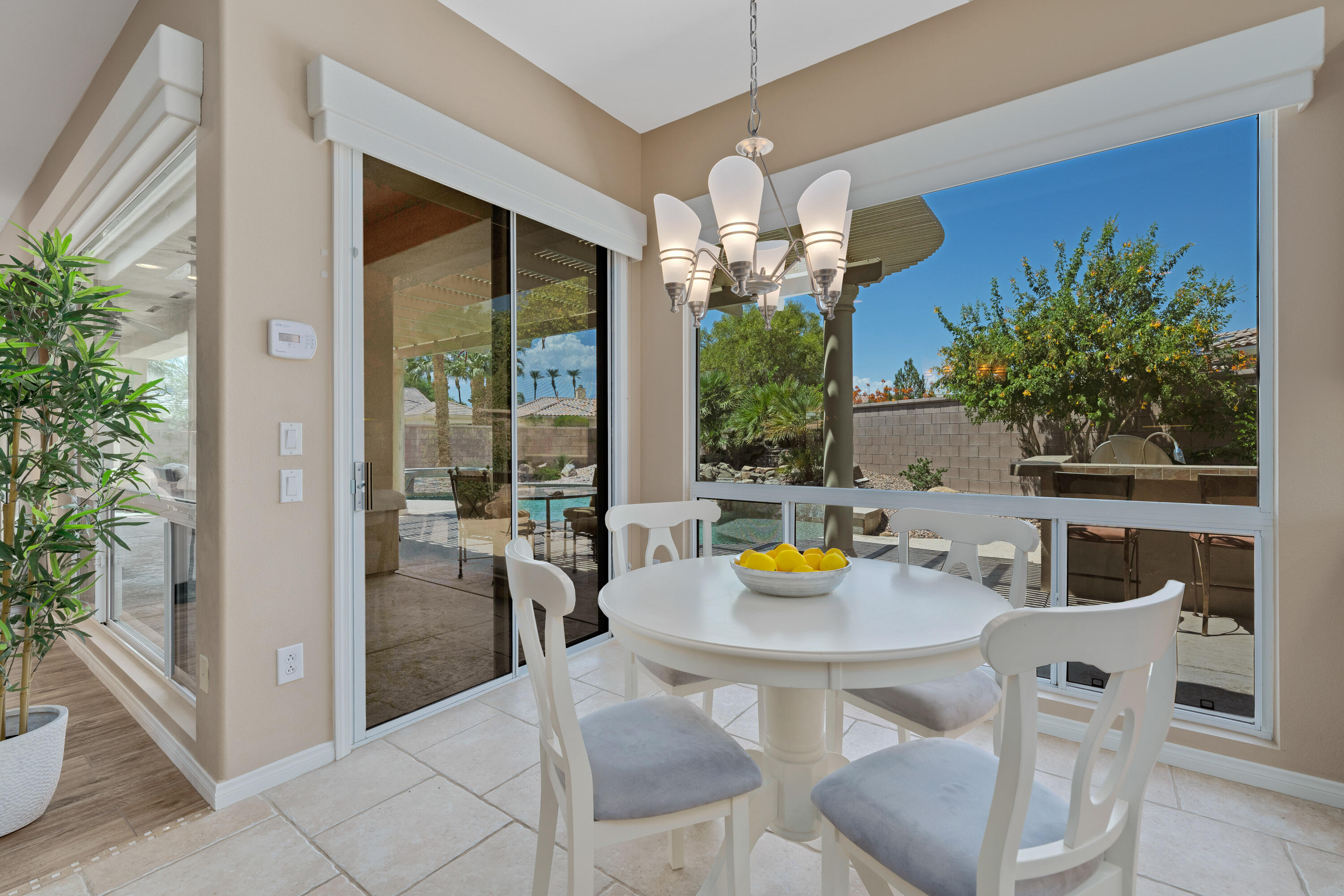 35691 Talus Lane Palm Desert, CA 92211 - Photo 24 of 39 a view of a dining room with a table and chairs