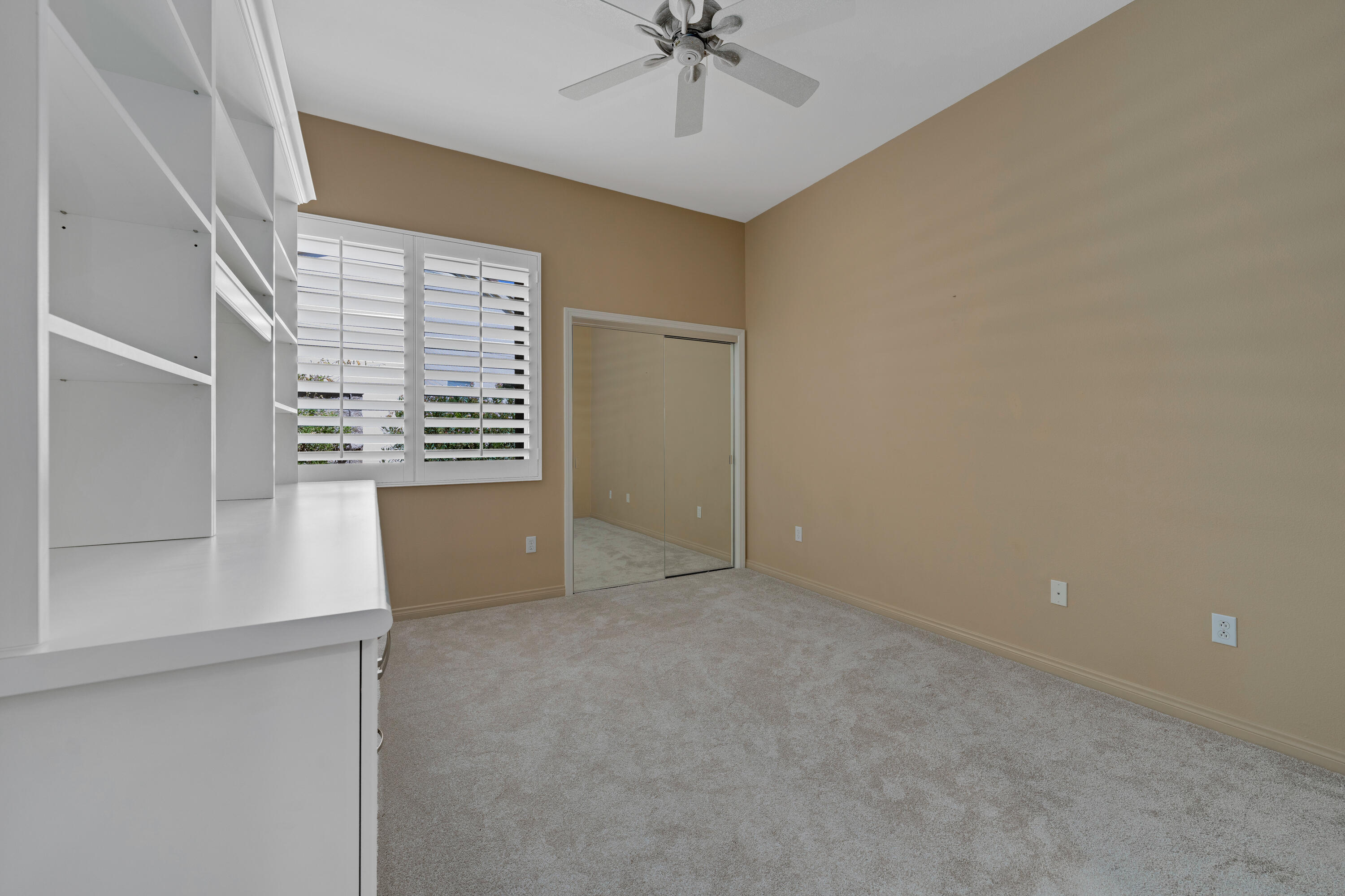 35691 Talus Lane Palm Desert, CA 92211 - Photo 29 of 39 an empty room with windows and ceiling fan