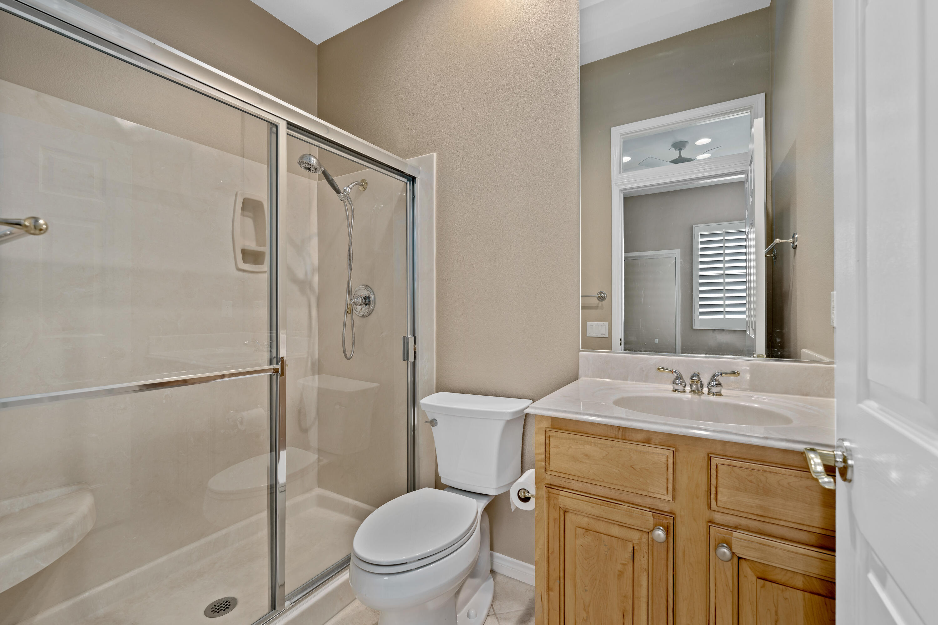 35691 Talus Lane Palm Desert, CA 92211 - Photo 30 of 39 a bathroom with a granite countertop sink toilet and shower