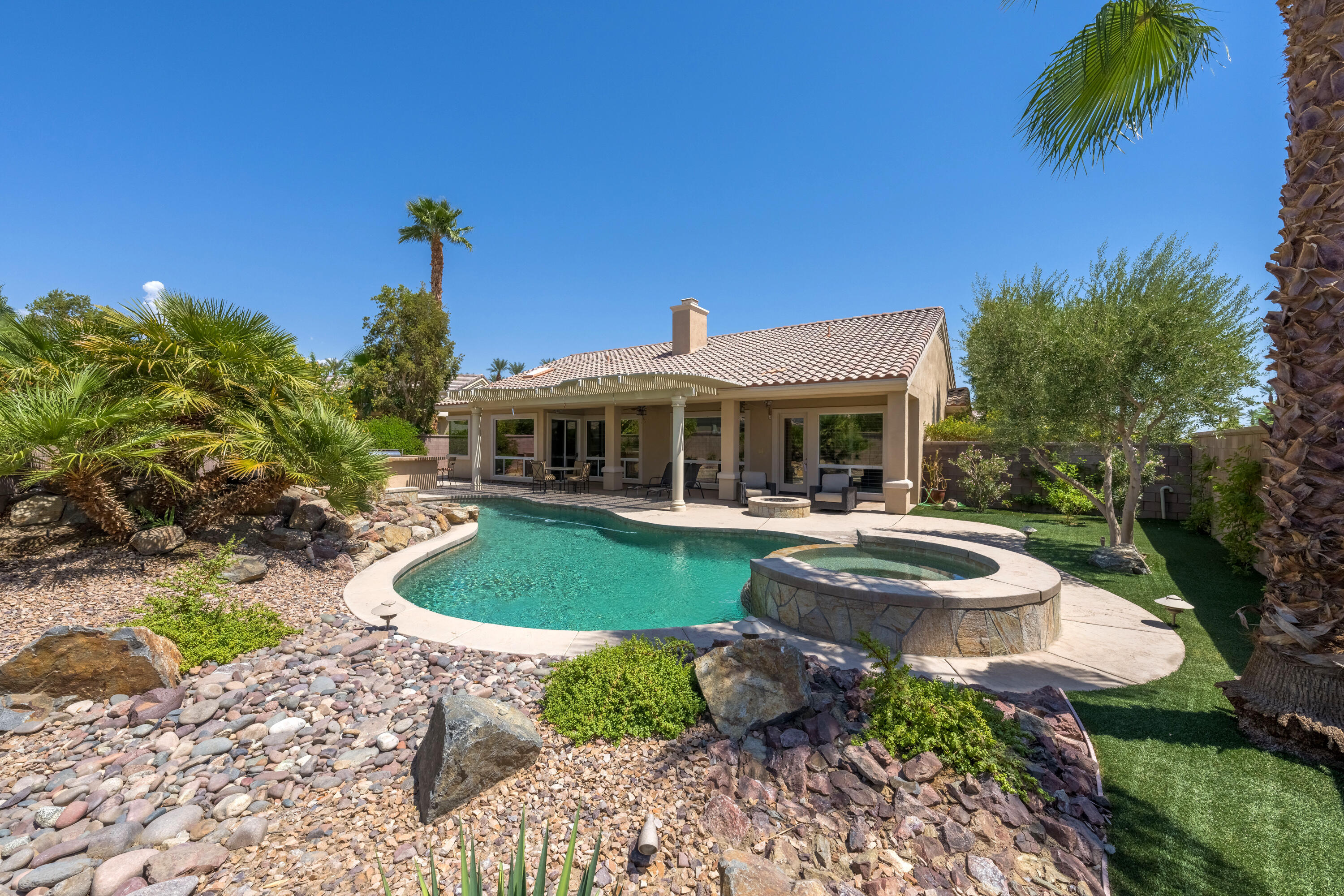 35691 Talus Lane Palm Desert, CA 92211 - Photo 37 of 39 a front view of a house with garden and porch