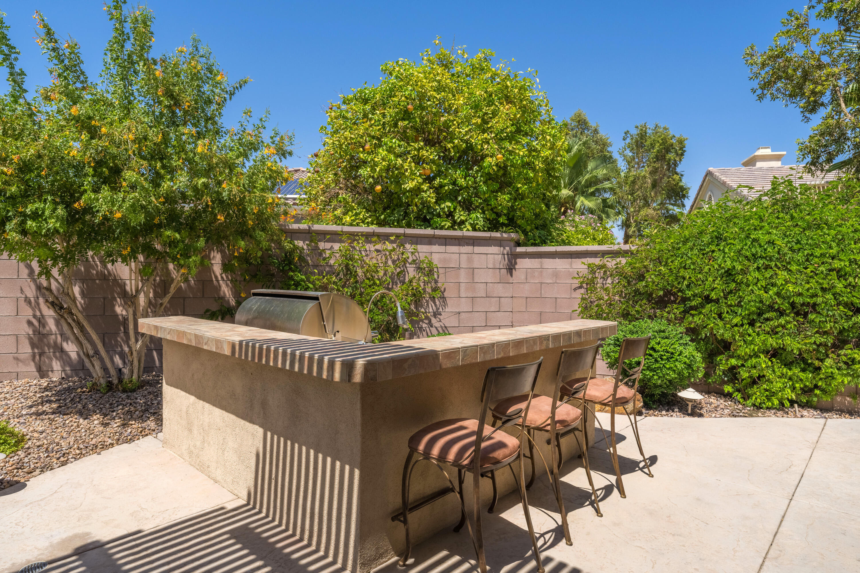35691 Talus Lane Palm Desert, CA 92211 - Photo 38 of 39 a view of a roof deck with table and chairs and potted plants