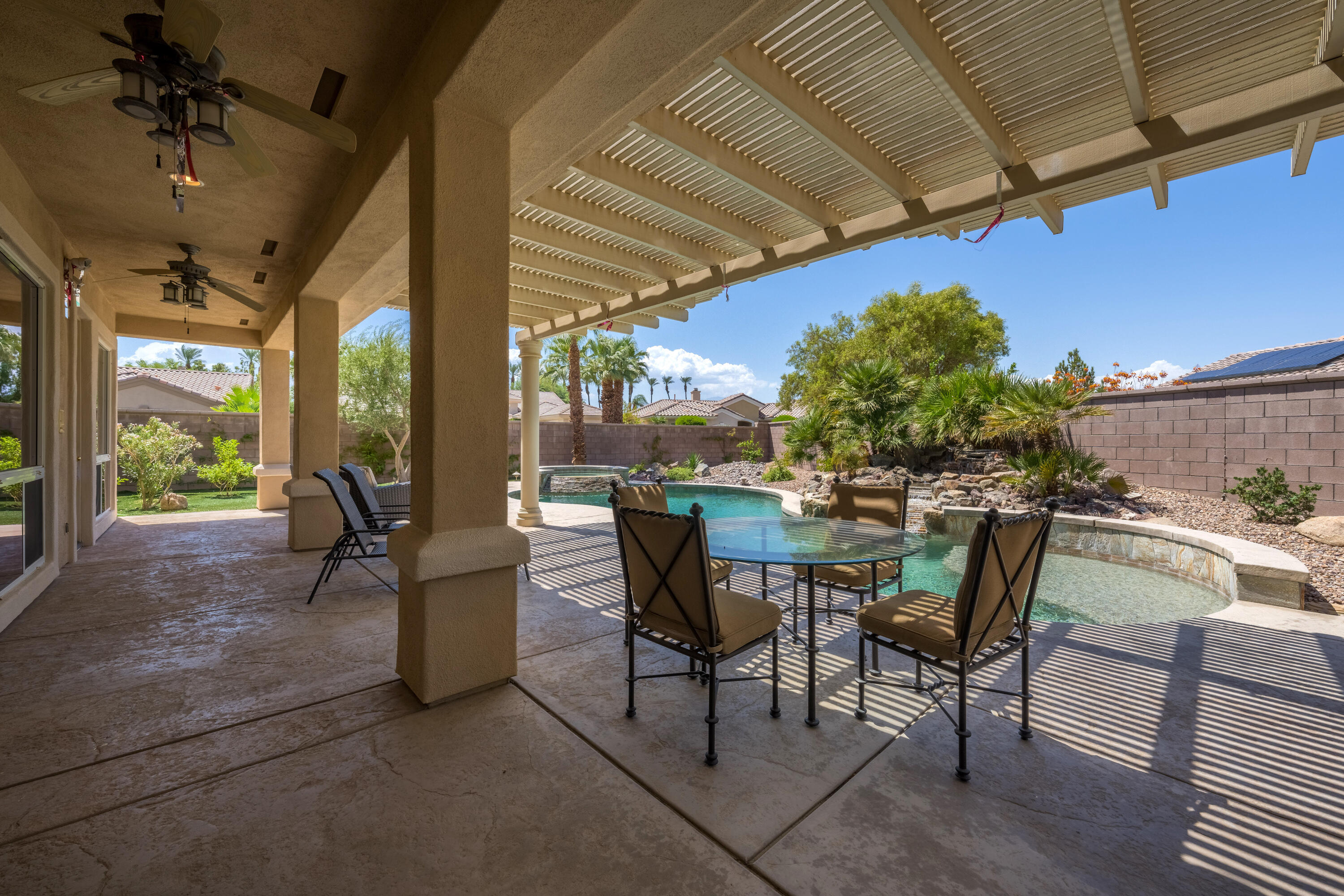 35691 Talus Lane Palm Desert, CA 92211 - Photo 5 of 39 a view of a patio with a table and chairs
