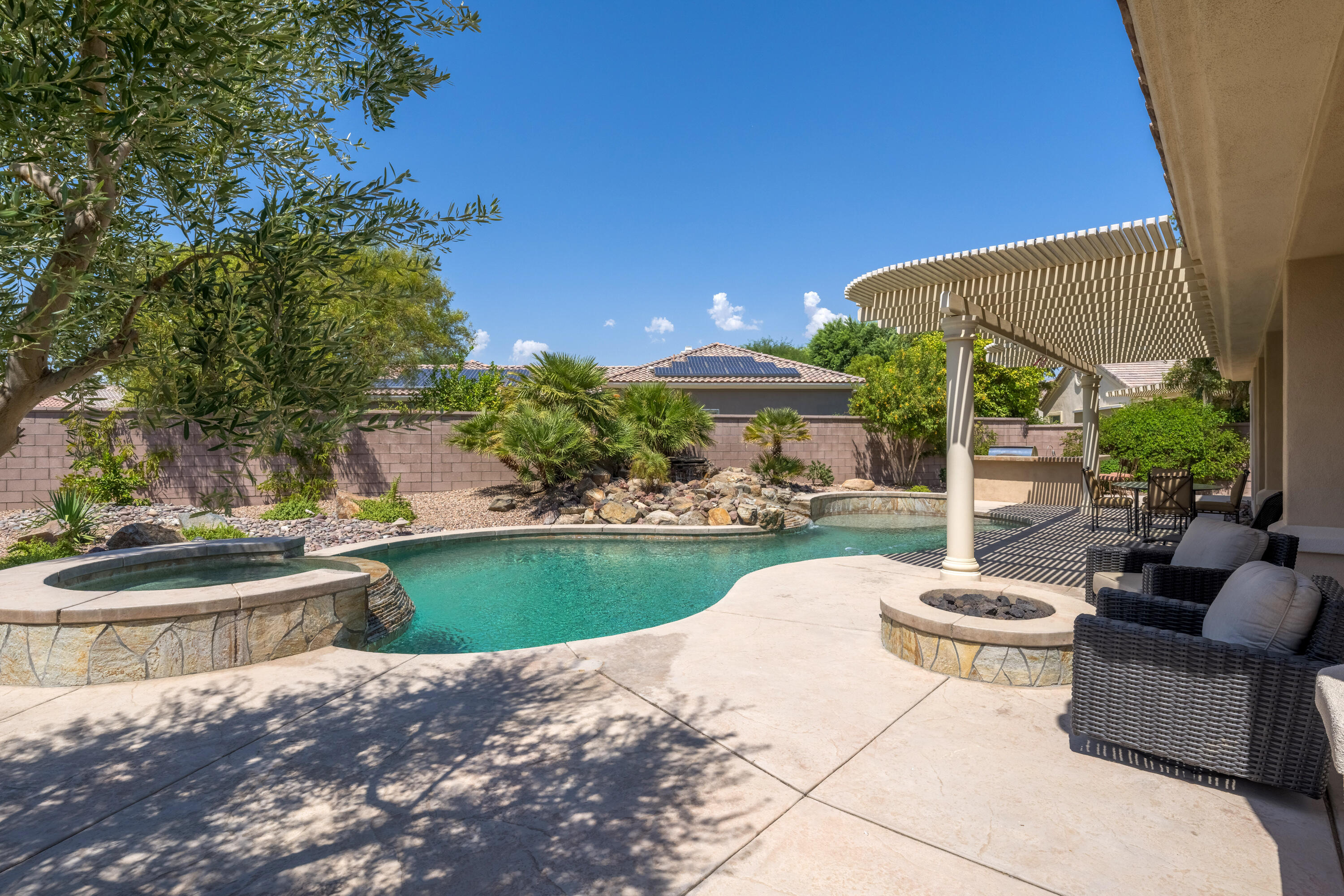 35691 Talus Lane Palm Desert, CA 92211 - Photo 7 of 39 a view of a patio with couches table and chairs and potted plants