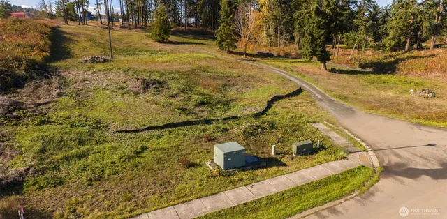 a view of a yard with an ocean view