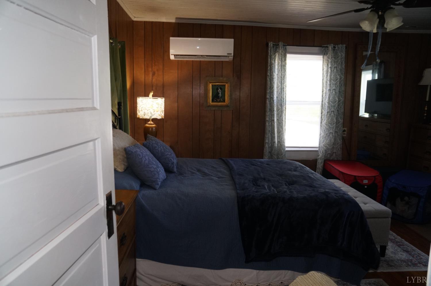 10188 Stage Coach Road Gretna, VA 24557 - Photo 15 of 56 a bedroom with a bed and window