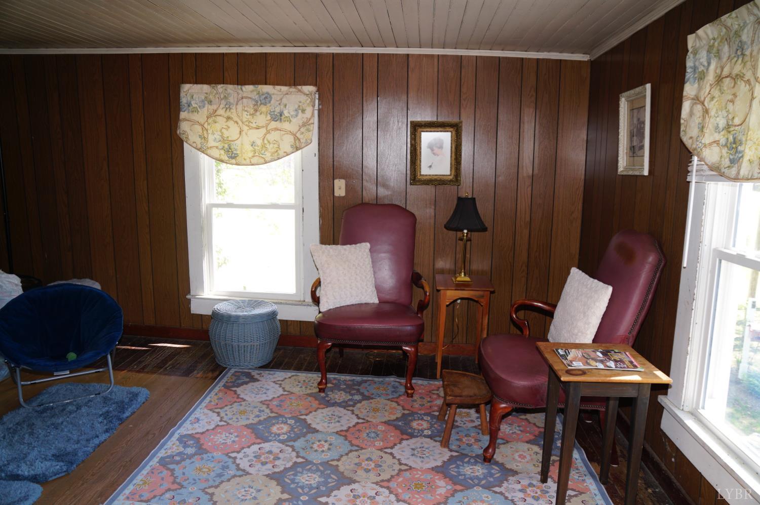 10188 Stage Coach Road Gretna, VA 24557 - Photo 17 of 56 a living room with furniture and a window
