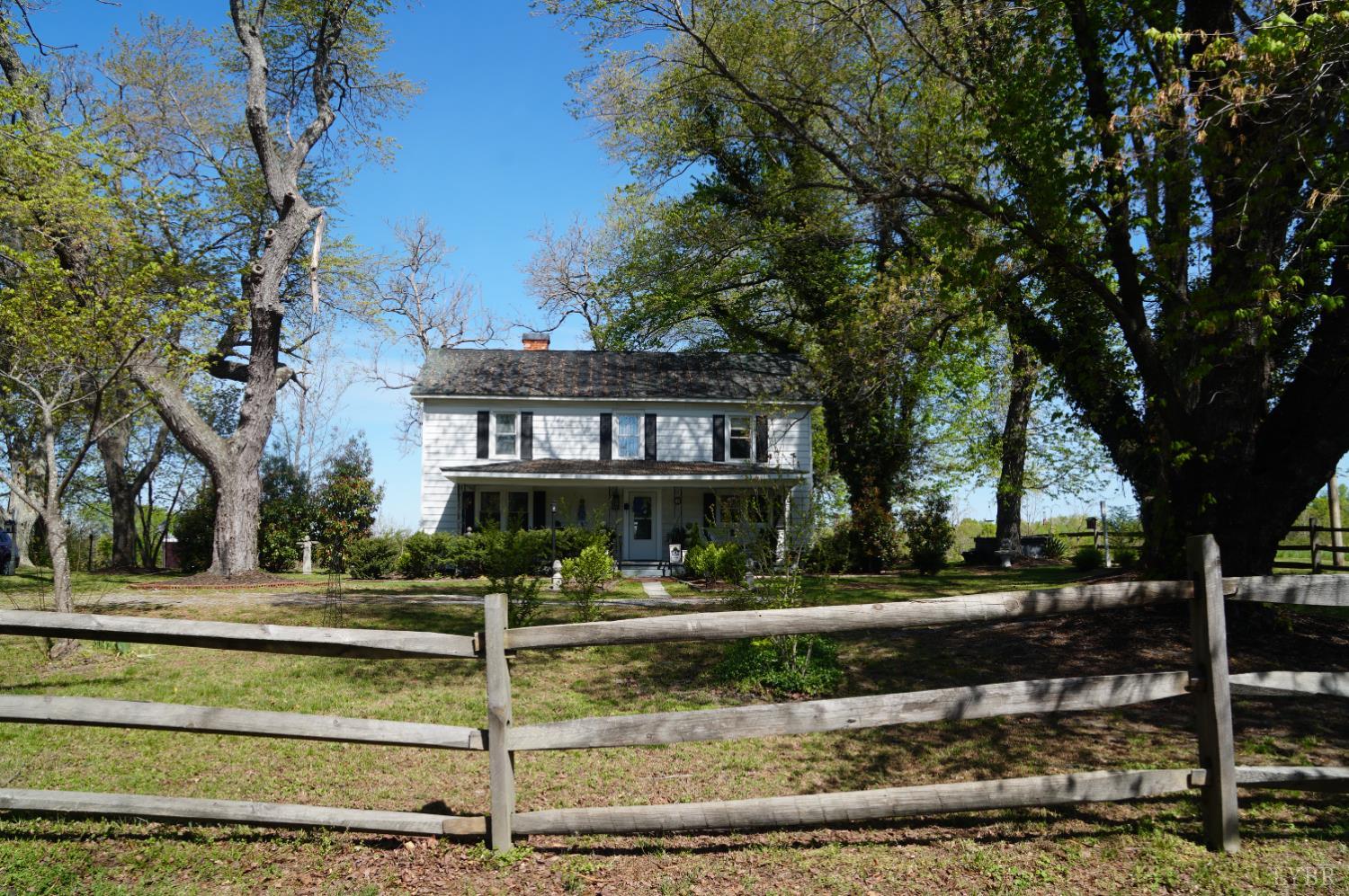 10188 Stage Coach Road Gretna, VA 24557 - Photo 2 of 56 a front view of a house with a yard