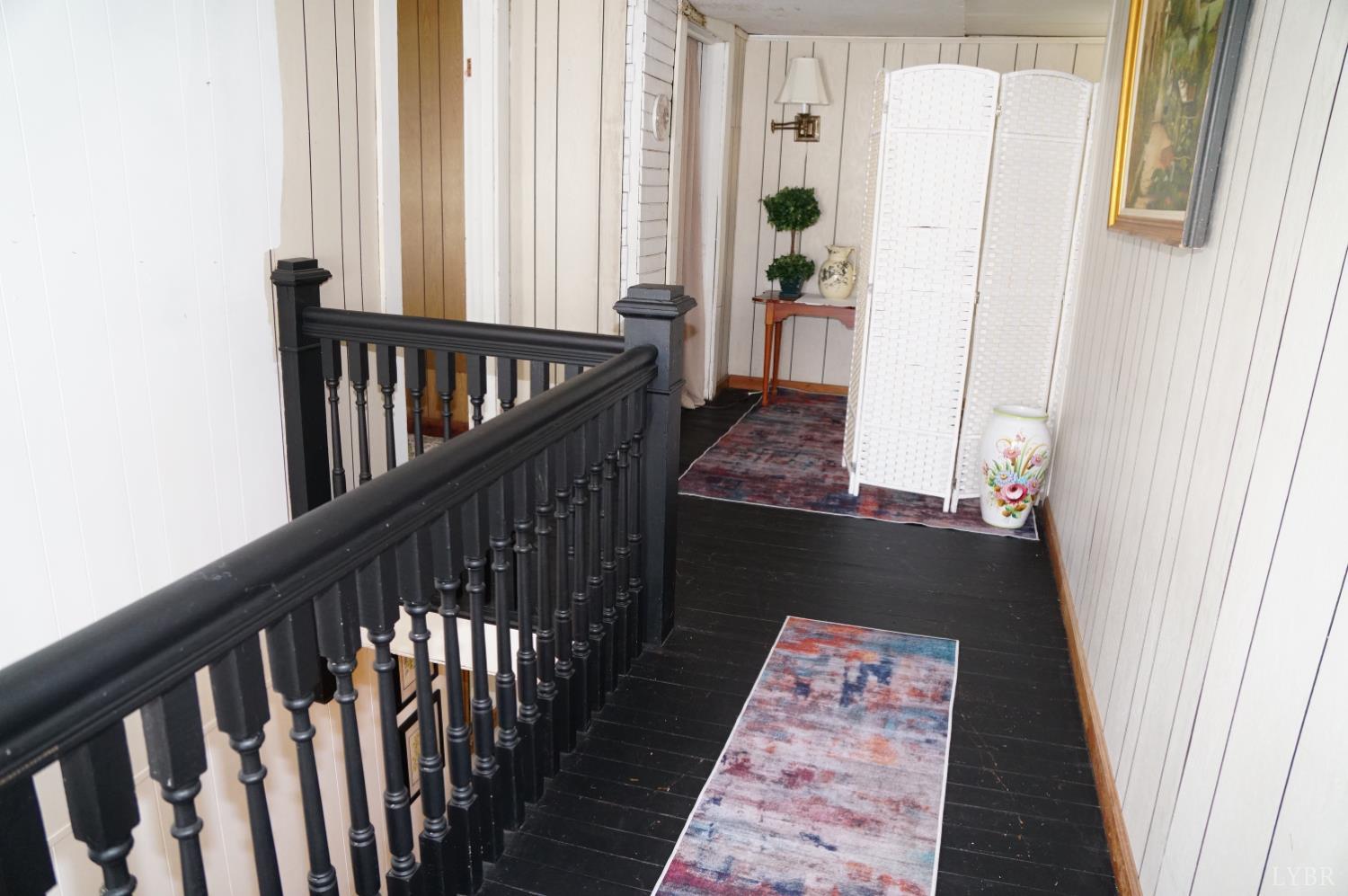 10188 Stage Coach Road Gretna, VA 24557 - Photo 21 of 56 a view of balcony with wooden floor and stairs