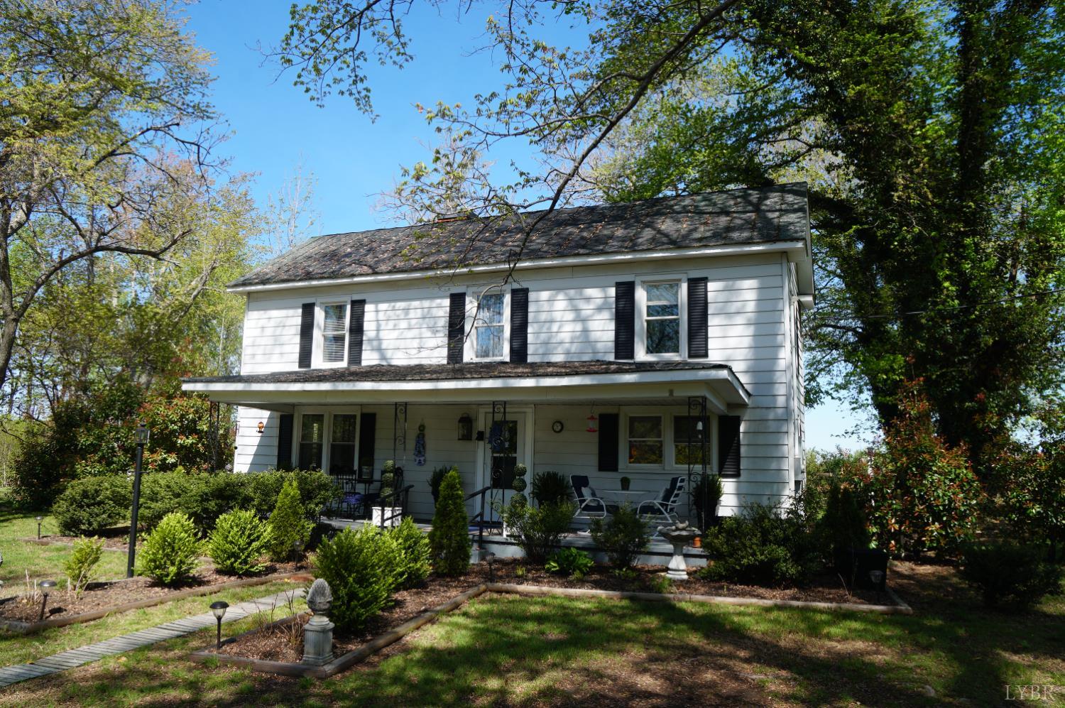 10188 Stage Coach Road Gretna, VA 24557 - Photo 29 of 56 front view of a house with a yard
