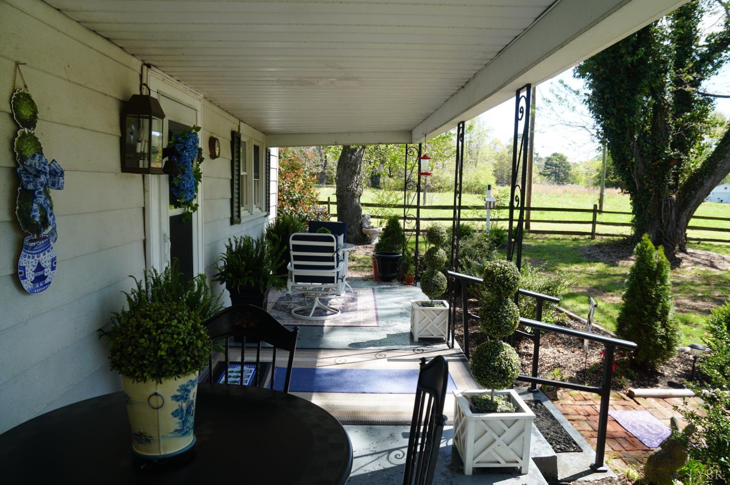10188 Stage Coach Road Gretna, VA 24557 - Photo 35 of 56 a living room with furniture and garden view