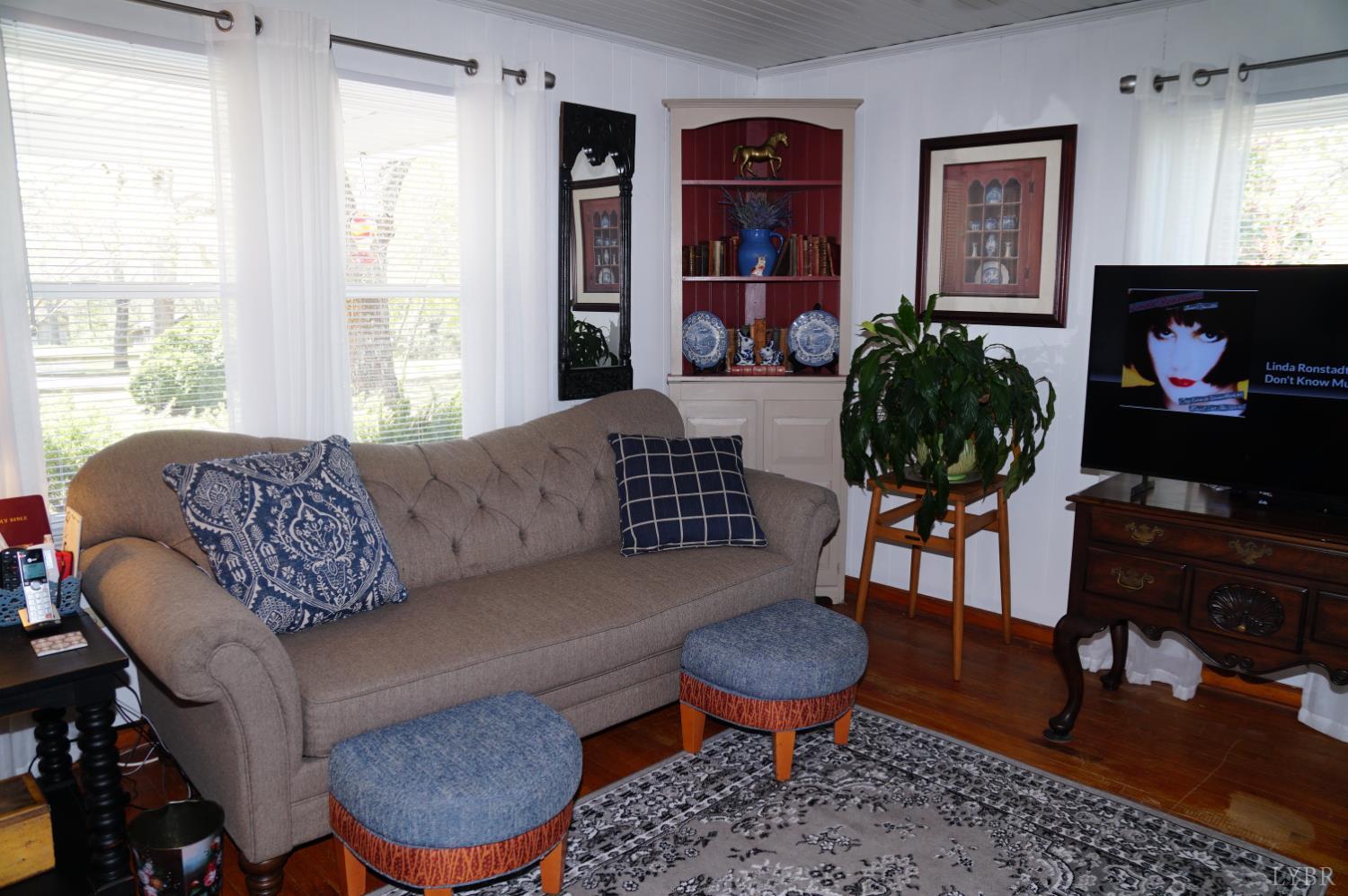 10188 Stage Coach Road Gretna, VA 24557 - Photo 4 of 56 a living room with furniture a rug and a window