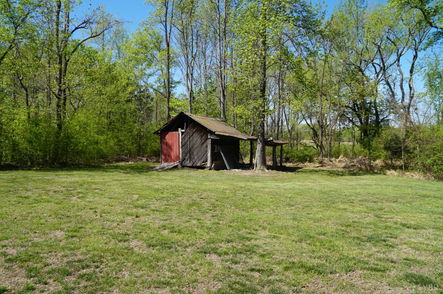 10188 Stage Coach Road Gretna, VA 24557 - Photo 41 of 56 a view of a barn in the middle of a yard