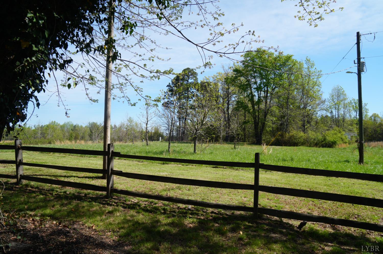 10188 Stage Coach Road Gretna, VA 24557 - Photo 45 of 56 a view of a yard with wooden fence