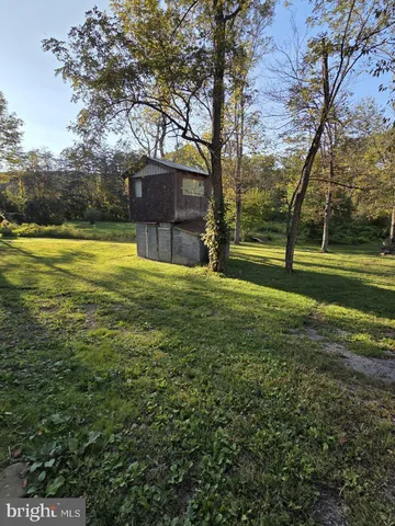 a view of swimming pool with an outdoor space and seating area