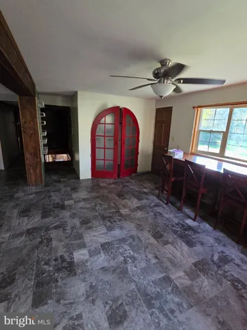 a view of empty room with windows