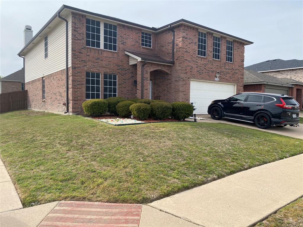 5301 Temecula Road Fort Worth, TX 76244 - Photo 2 of 7 a front view of a house with a garden and yard