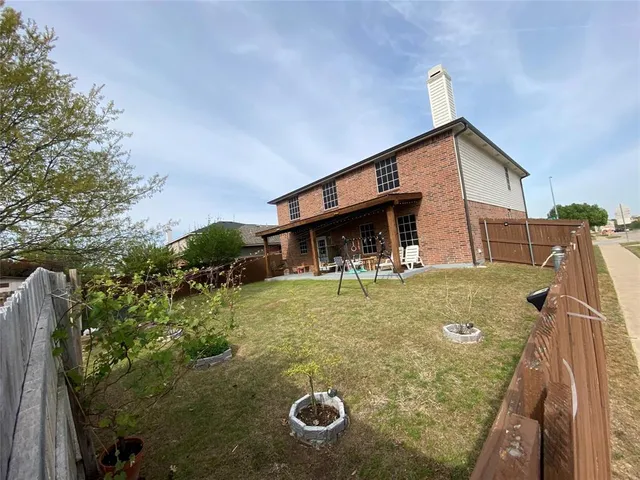 a front view of a house with a fence