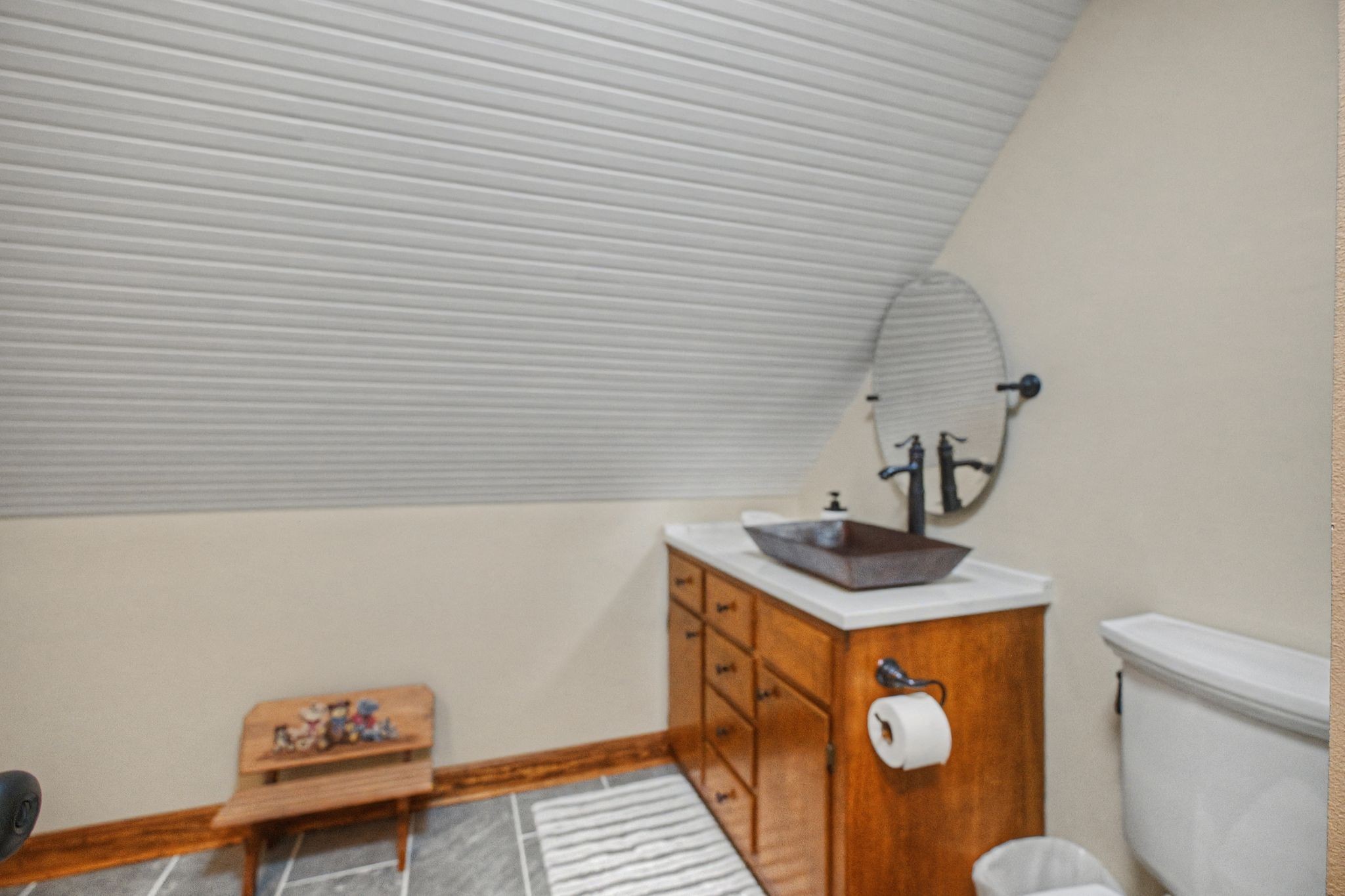 1231 Abiff Road Bon Aqua, TN 37025 - Photo 32 of 60 a bathroom with a sink a toilet and a shower