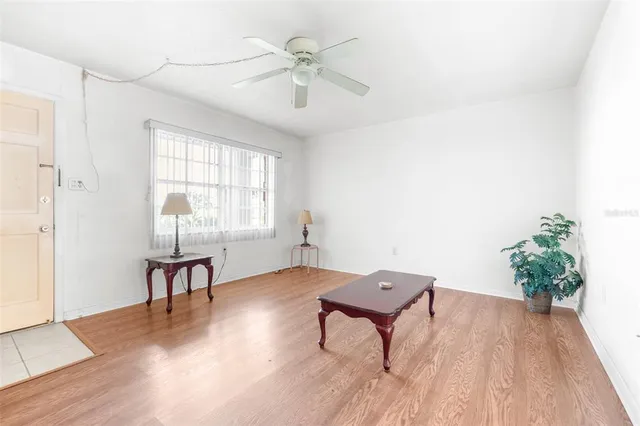 a workspace with furniture window and wooden floor
