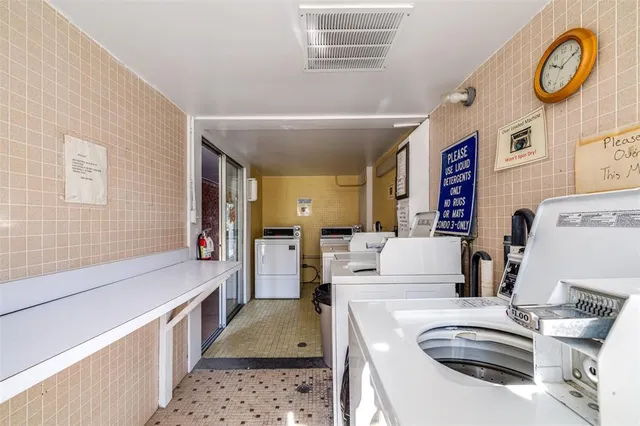 a kitchen with a sink and a stove top oven