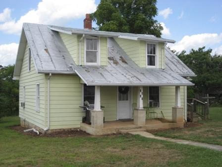 1568 Edwardsville Road Hardy, VA 24101 - Photo 14 of 14 a view of a white house with a small yard and a large window