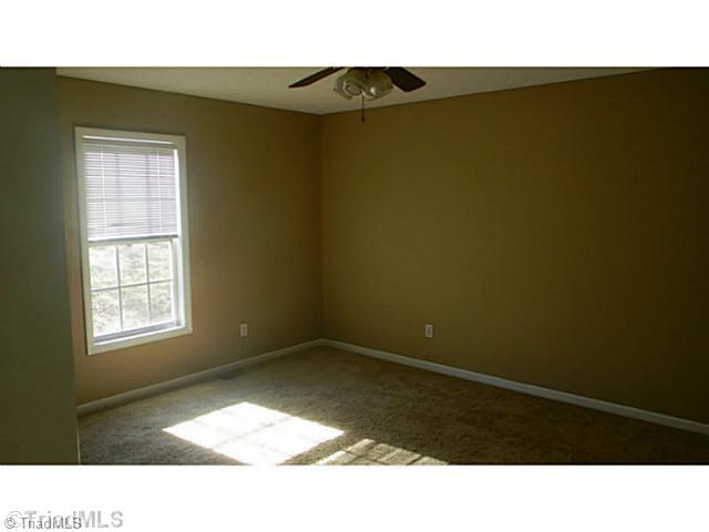 7004 Tree Hollow Road Thomasville, NC 27360 - Photo 11 of 16 2nd Bedroom. one of 2 guest bedrooms. This bedroom offers a large walk in closet also.