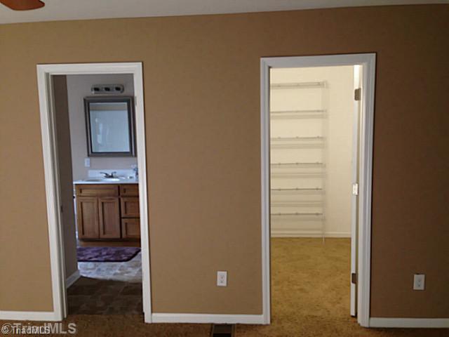 7004 Tree Hollow Road Thomasville, NC 27360 - Photo 8 of 16 Master Bedroom. Large Bath and Walk in Closet in Master Suite