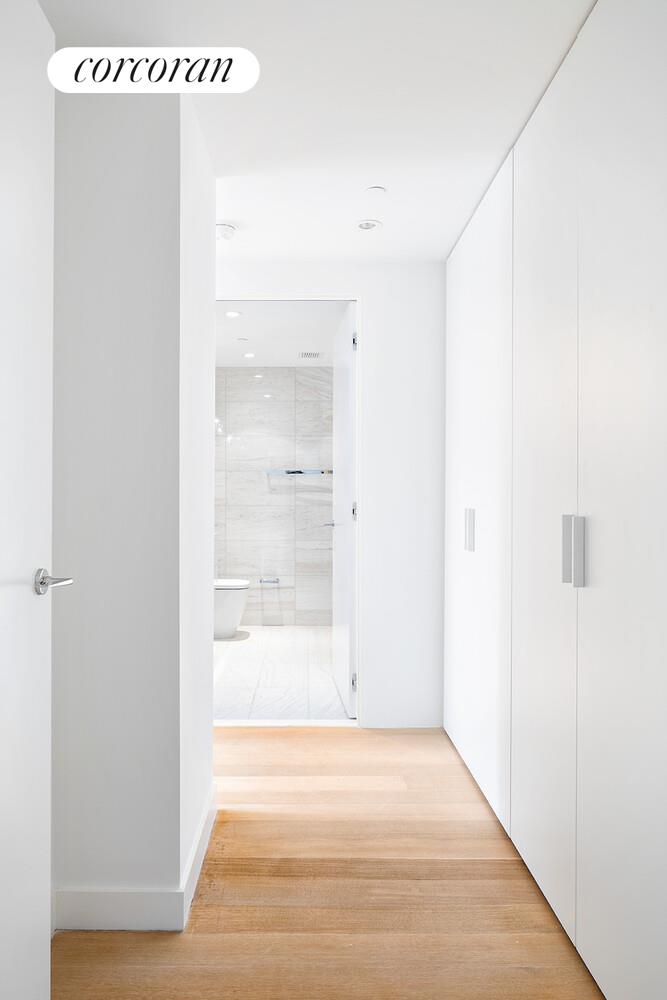 135 West 52nd Street, Unit 31B Manhattan, NY 10019 - Photo 7 of 9 a view of a room with wooden floor