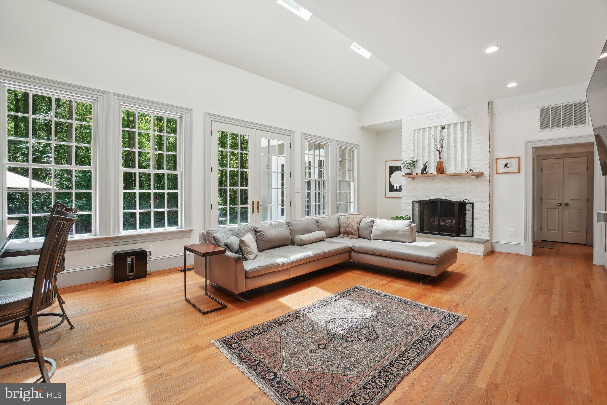 8683 Reservoir Road Fulton, MD 20759 - Photo 13 of 60 a living room with furniture and a fireplace