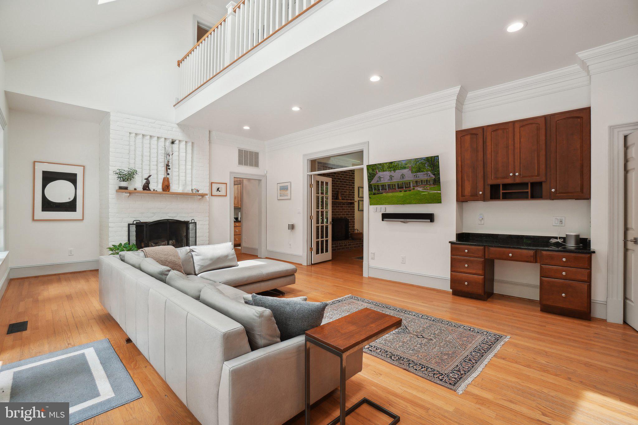 8683 Reservoir Road Fulton, MD 20759 - Photo 14 of 60 a living room with furniture and a fireplace