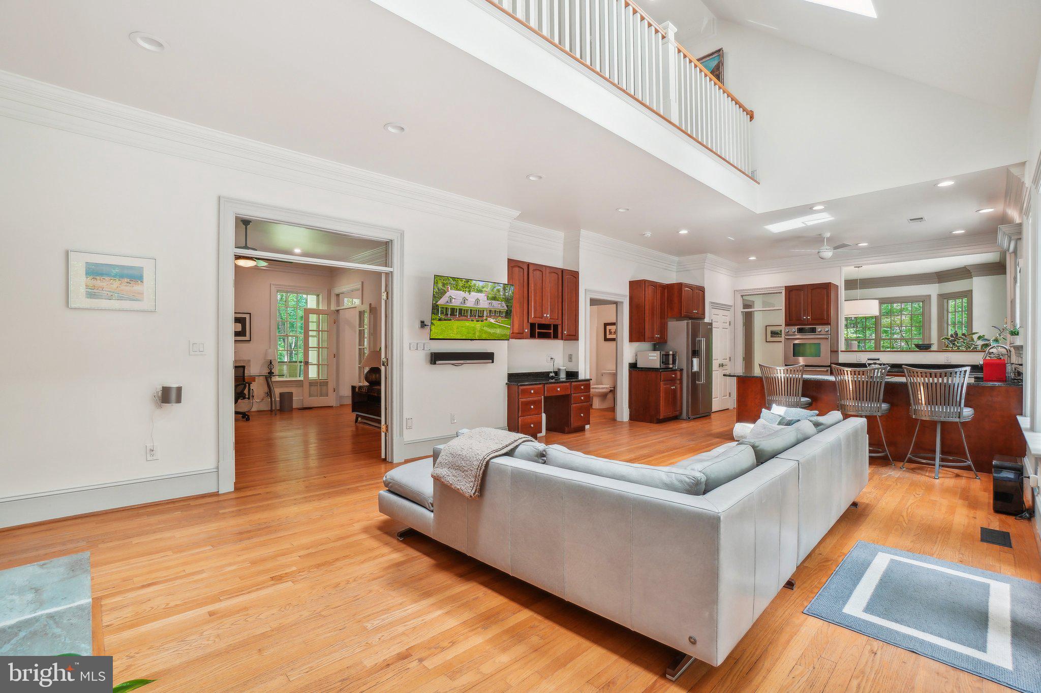 8683 Reservoir Road Fulton, MD 20759 - Photo 17 of 60 a living room with furniture and a wooden floor