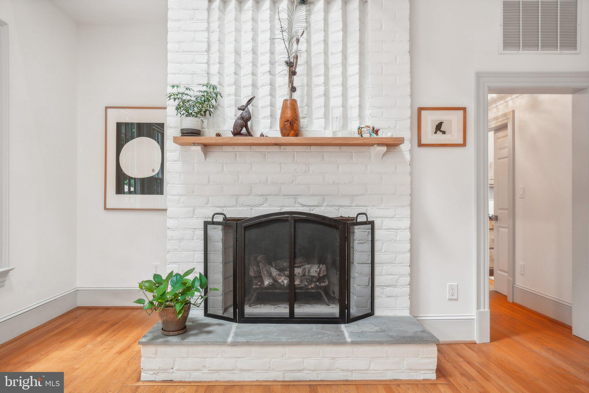 8683 Reservoir Road Fulton, MD 20759 - Photo 18 of 60 a living room with furniture and a fireplace