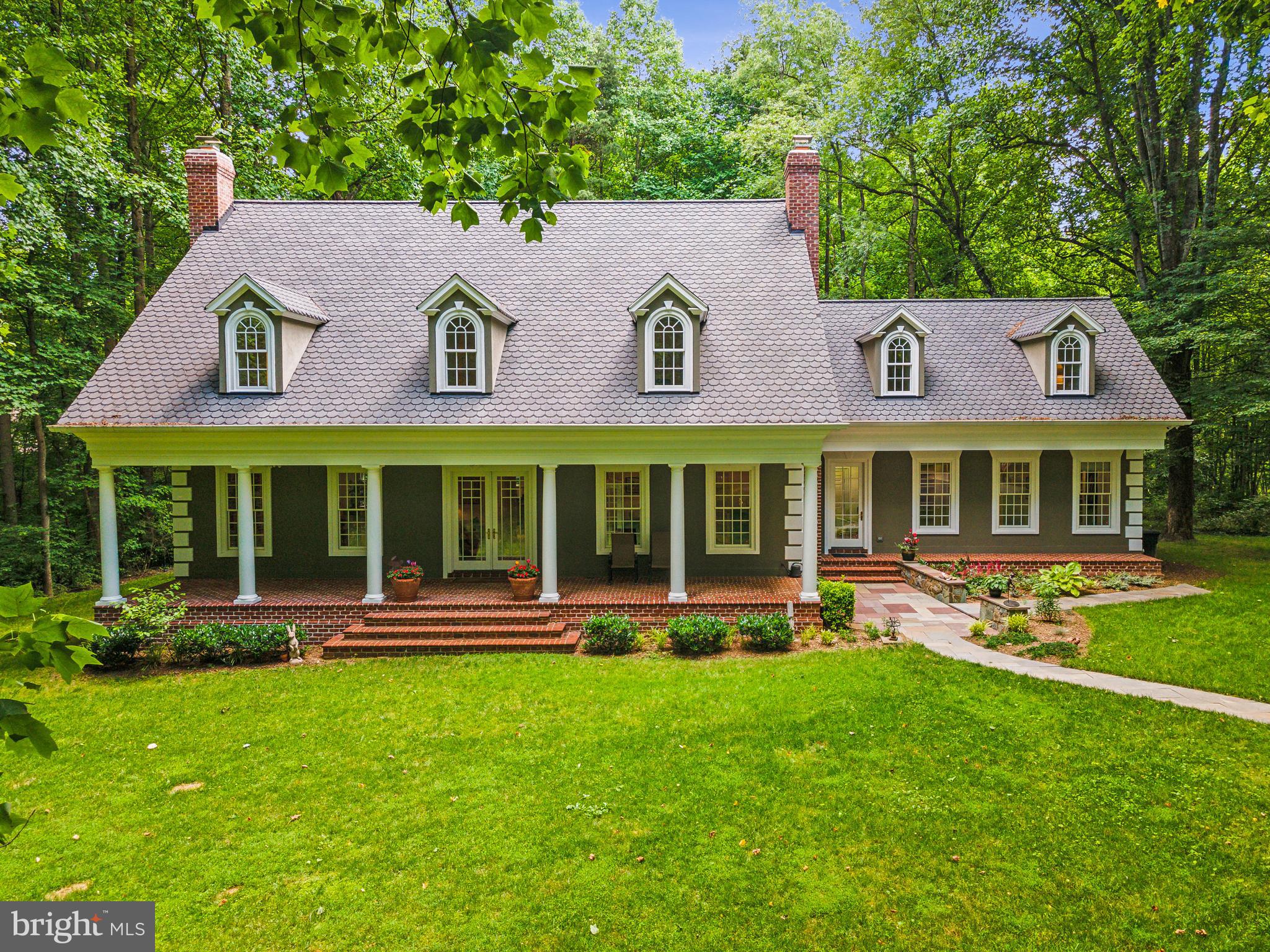 8683 Reservoir Road Fulton, MD 20759 - Photo 2 of 60 front view of a brick building with a yard